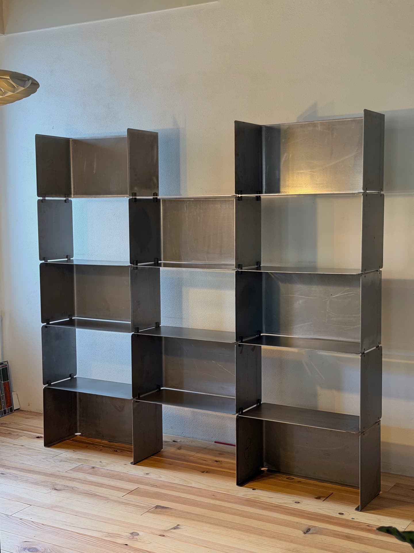 The empty shelving system showing its modular steel structure